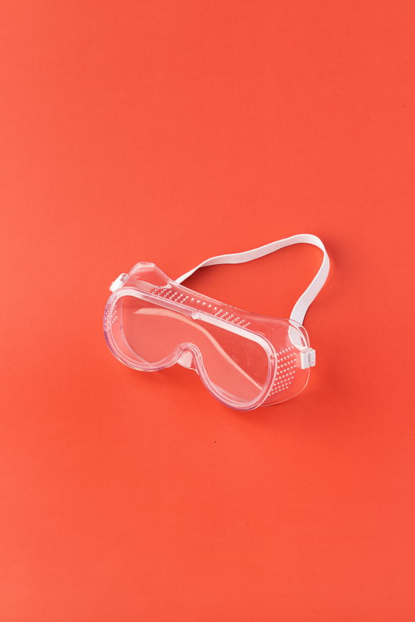 Protective Glasses on Orange Background